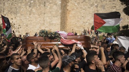 Mourners attend the funeral of Al Jazeera reporter Shireen Abu Akleh on May 13, 2022 in Jerusalem, Israel. (Photo by Amir Levy/Getty Images)