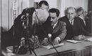 David Ben-Gurion signs the Declaration of Independence held by Moshe Sharet with Eliezer Kaplan looking on at the Tel Aviv Museum, on May 14, 1948. (Photo: Israel Government Press Office / Wikipedia Commons)