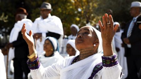 Israeli women from the Ethiopian Jewish community pray during the Sigd holiday marking the desire to 'return to Jerusalem', as they celebrate from a hilltop in the holy city overlooking the Temple Mount, on November 16, 2017.
Sigd used to mark the aspirations of Ethiopian Jews to go to Jerusalem and  nowadays the festivity is celebrated in Jerusalem with thousands of Ethiopians from all over Israel congregating to pray together, led by their religious leaders, the 'Kessim' who recites prayers while they overlook the old city of Jerusalem. / AFP PHOTO / GALI TIBBON