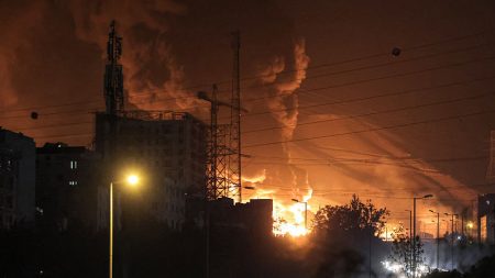 A fire blazes in the oil depots of Shahran, northwest of Tehran, on June 15, 2025. Photo by Atta KENARE / AFP